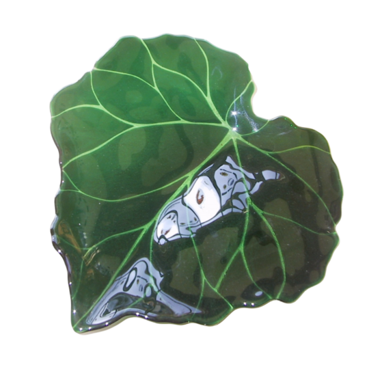 a green decorative art glass piece in the shape of a very large leaf with intricate details forming the veins